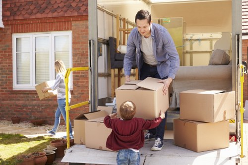 Removal van and moving team working in a Finsbury Park street