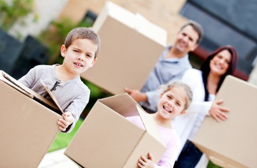 Boxes and furniture being loaded into a moving truck for a North London relocation