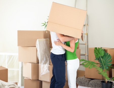 Removal team loading items from a flat in North London