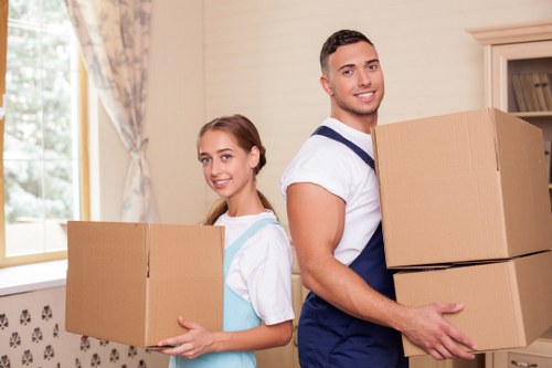 Packed moving boxes and furniture ready for a home relocation