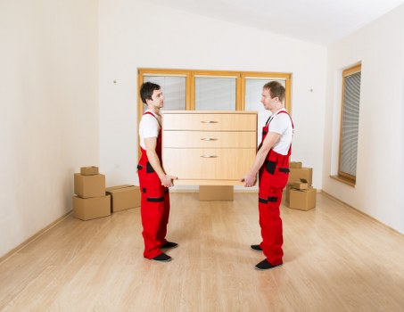 Removal crew reviewing safety checks before loading furniture